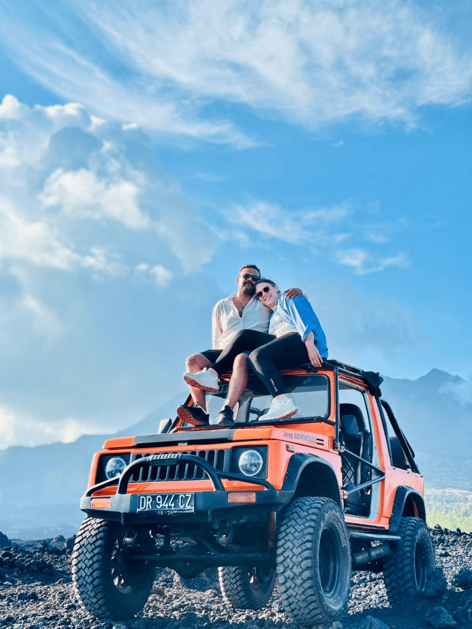 Couple riding a jeep through Mount Batur's mountain trails